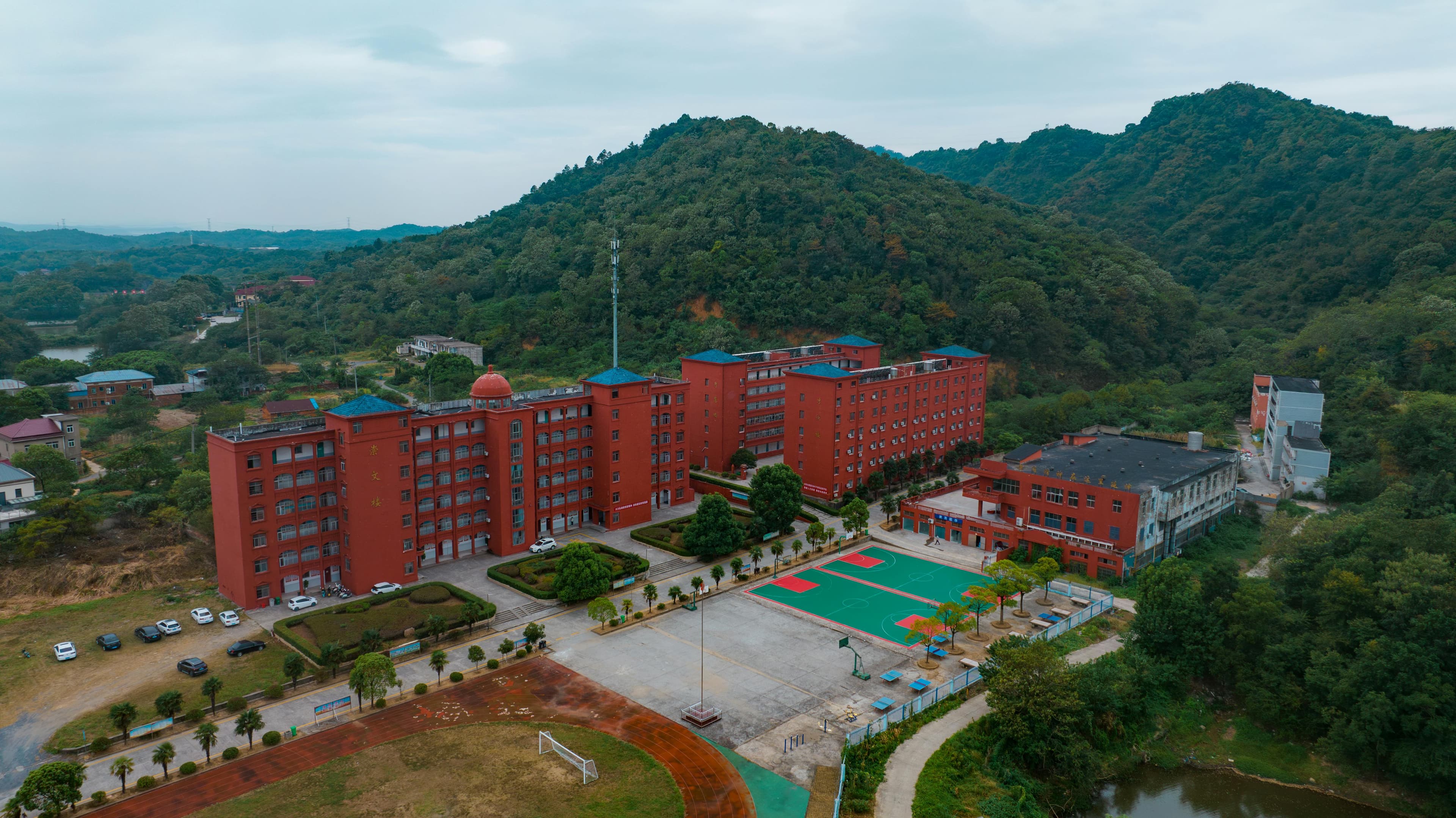 Modern school campus building with students walking during the day